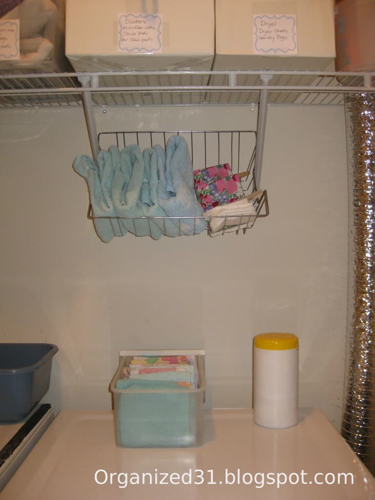 basket of towels hanging above dryer