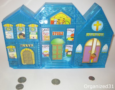a my giving bank with coins in front of it