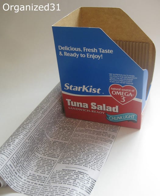 empty StarKist tuna salad box on a roll of newsprint wrapping paper