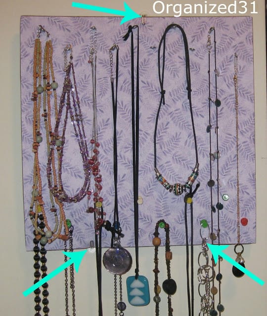 3 arrows pointing to show where the  decorated corkboard is hung on the wall