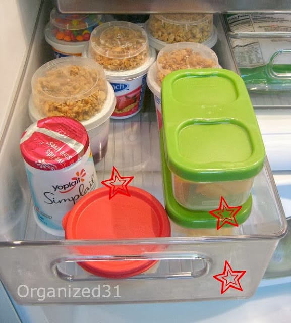 a drawer in a refrigerator with some products inside with red stars on them to show USA made products