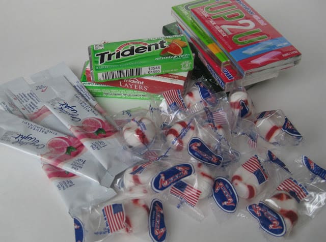pile of gum, candy and drink mix packets