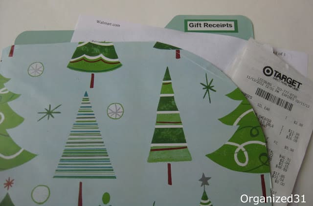 a gift receipt folder with Christmas trees on it
