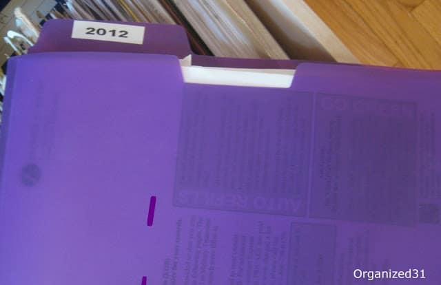 a purple file folder with a 2012 label on it.