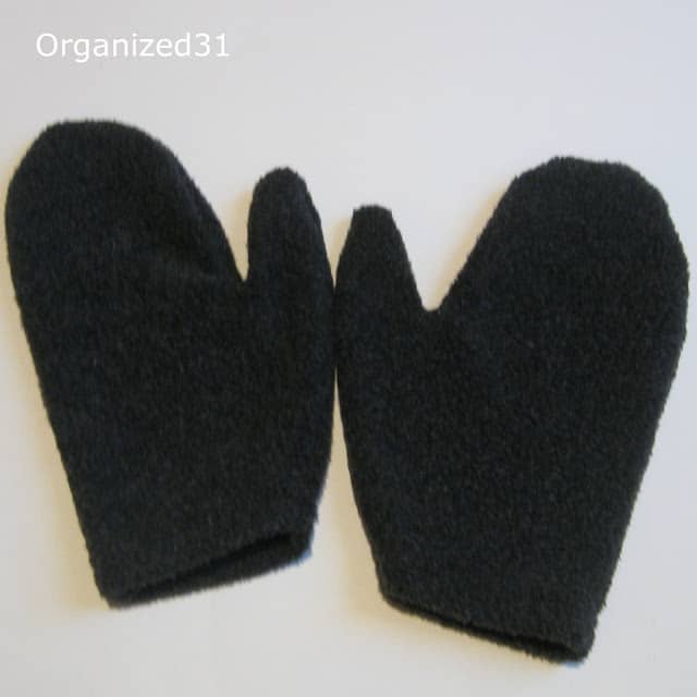 2 mittens made from a dark gray sweater with title text reading Organized 31