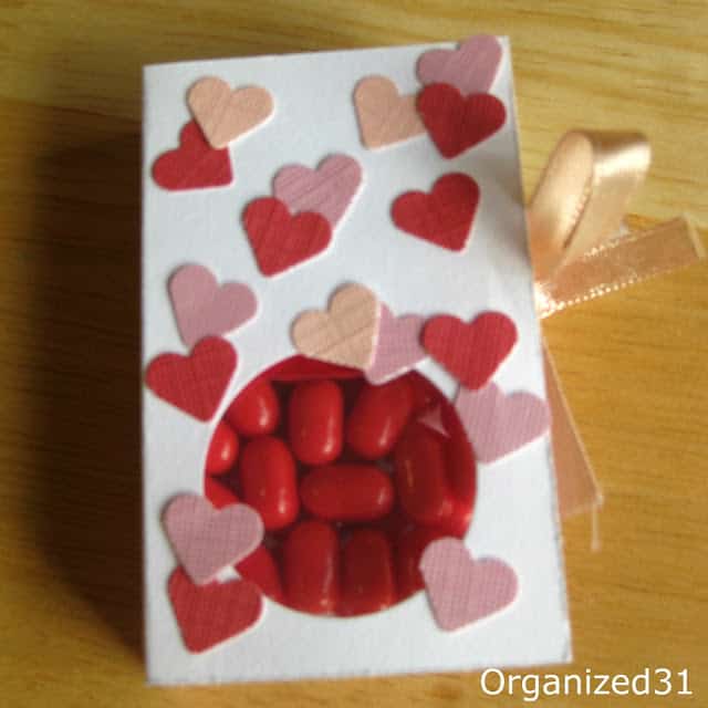 red tic tacs in a box decorated with hearts