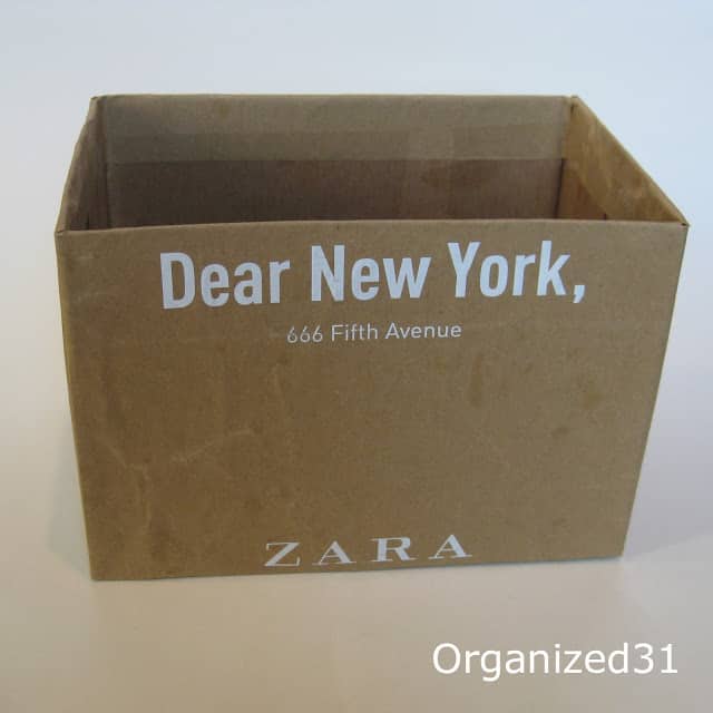 a cardboard box with text on it reading Dear New York, 666 Fifth Avenue Zara 