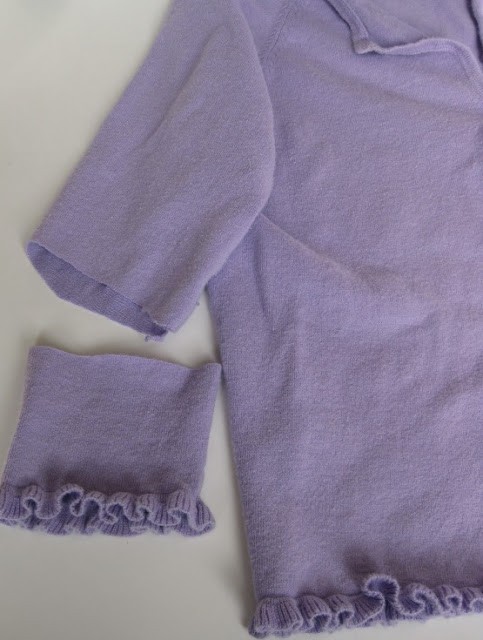 the sleeve cut off a purple sweater
