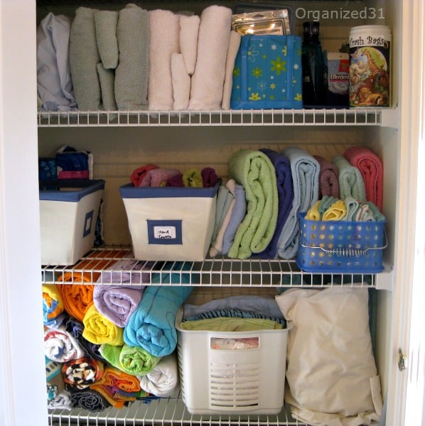 towels and sheets organized on wire shelved