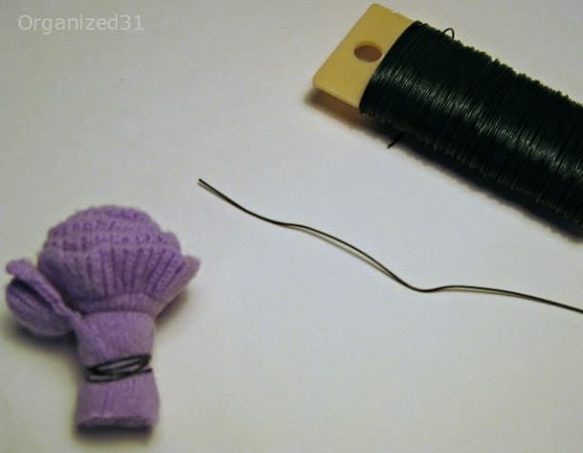 a purple fabric slower next to some wire