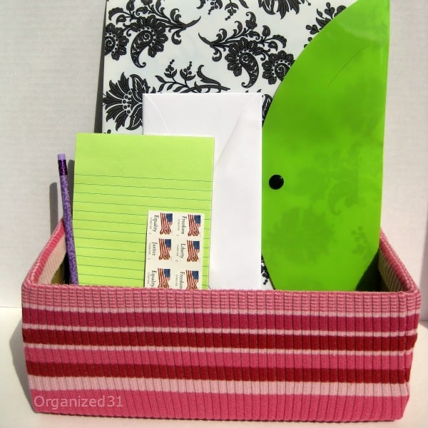 pencil, stamps, notepad, envelope, and file folder in an Upcycled Sweater Organizing Box