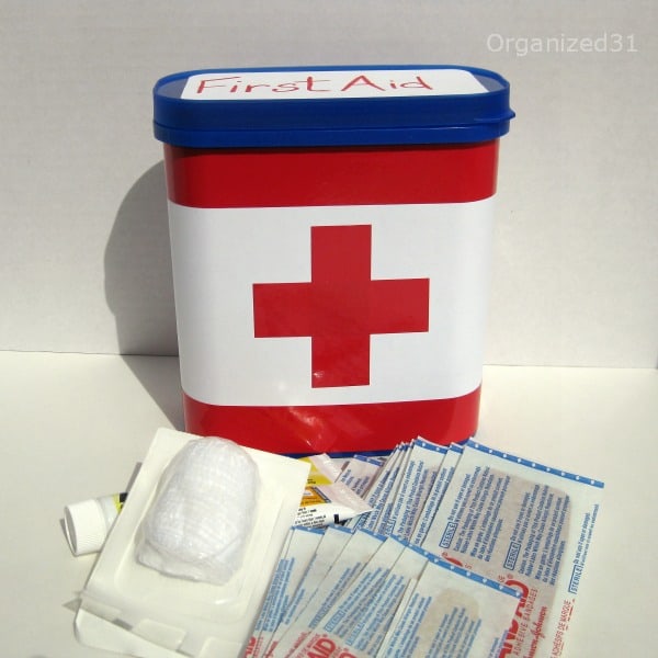 Repurposed plastic breakfast container to First Aid Kit
