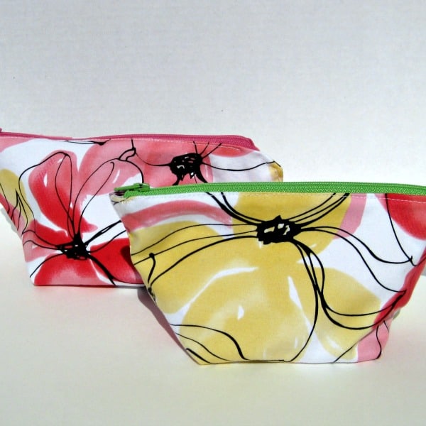 2 zippered floral pouches.