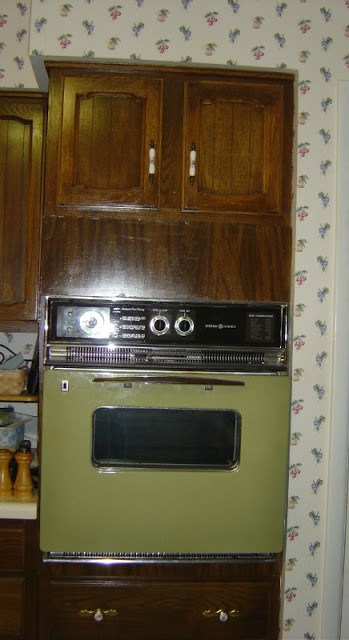 a stove and kitchen cabinets