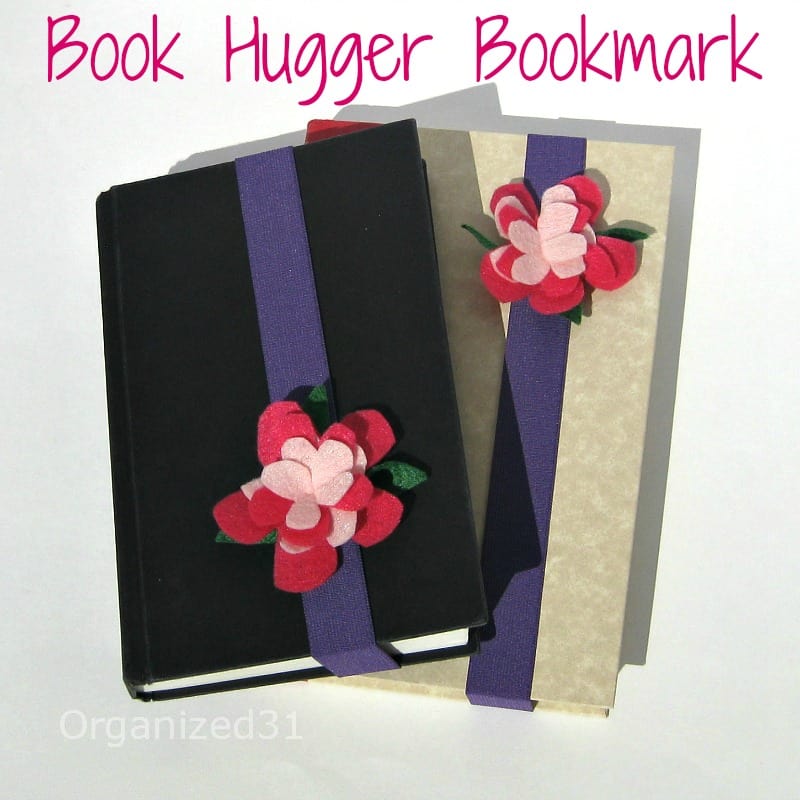 a black book and a tan book each with DIY pink flower book marks with title text reading Book Hugger Bookmark