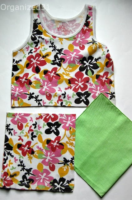 Hawaiian flower print tank top shown cut into pieces in preparation for DIY project.