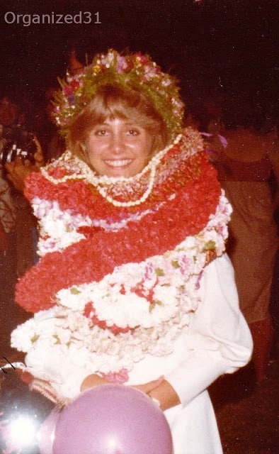 a young lady wearing lots of Graduation Leis