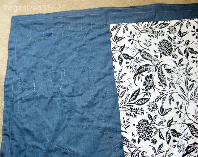a quilt that's blue on one side and black and white on the other
