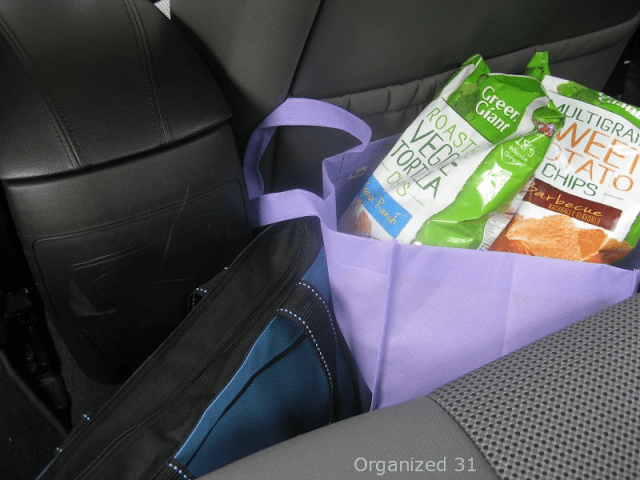 chips in a purple tote bag in a car