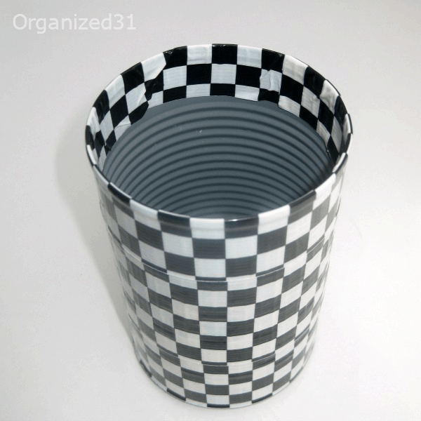 a can covered in black and white duct tape