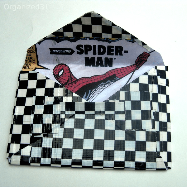 envelop-style duct tape wallet with Spider-man comic book design inside.