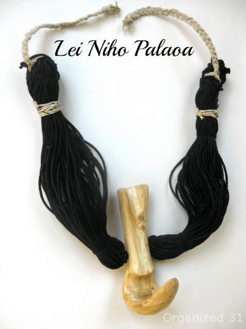a necklace from a costume for a Hula Competition wit title text reading Lei Niho Palaoa