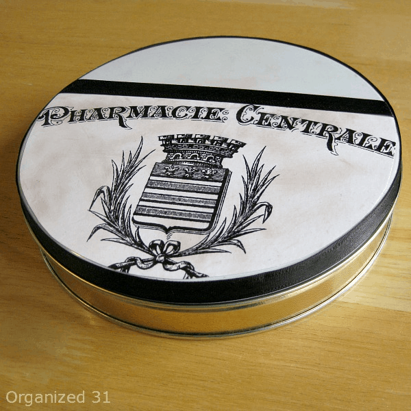 Repurposed diy decoupage craft organizing tin with vintage pharmacy image