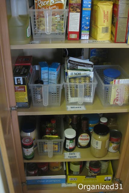 an organized kitchen pantry with labels on the shelves