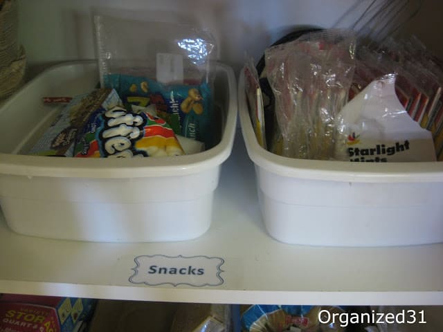 snacks in with tubs on a shelf labelled "snacks"
