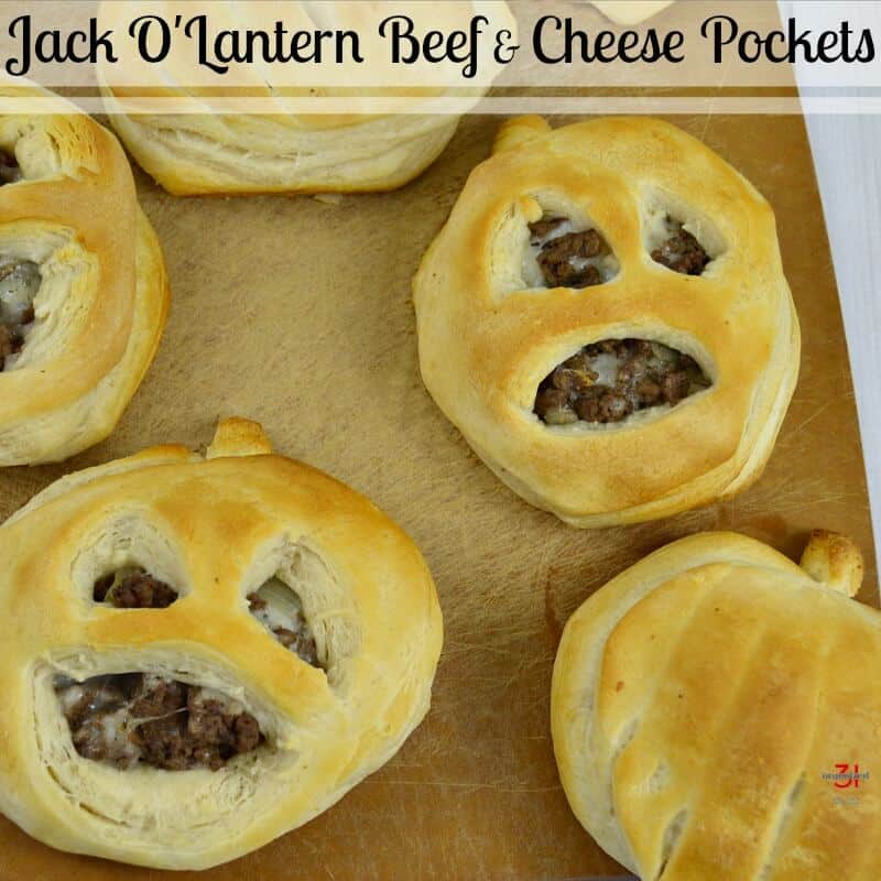 Halloween beef stuffed biscuit jack o lantern shaped with text overlay
