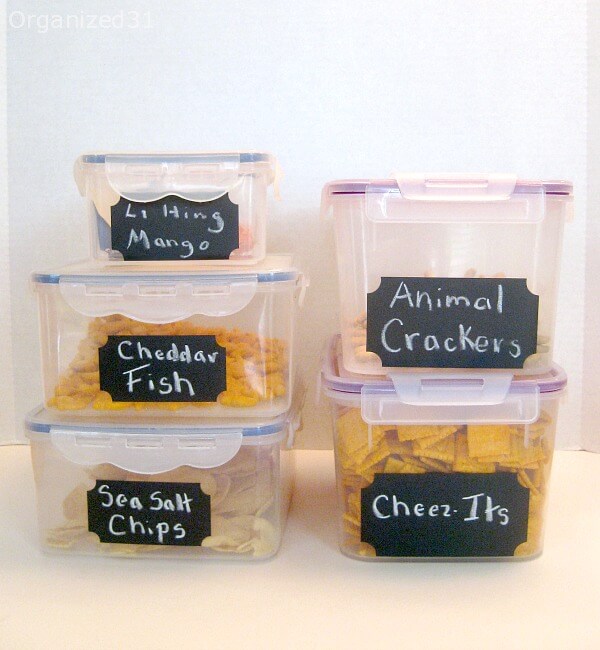 2 stacks of plastic rectangular food storage containers with black chalkboard lables