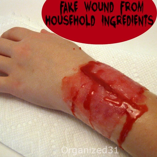 child's arm with DIY bloody special effects wound with title text reading Fake Wound From Household Ingredients
