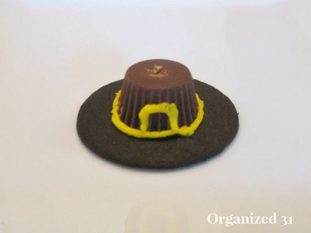 a cookie decorated to look like a pilgrim hat