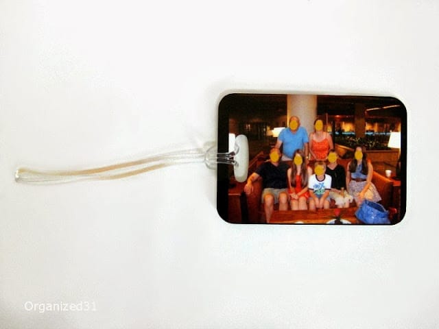 a luggage tag with an image of a family on it