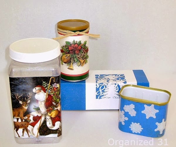 repurposed plastic food jars and containers decorated with Christmas paper.