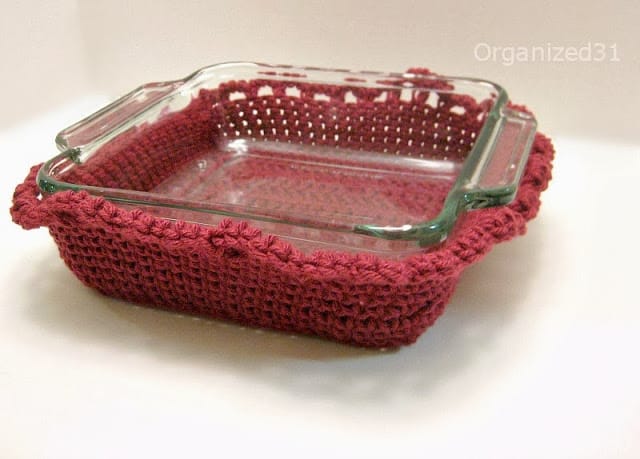 top view of maroon crocheted cozy around glass casserole dish.