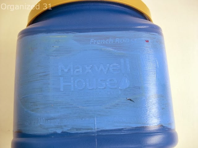 a Maxwell House container with blue paint on it.