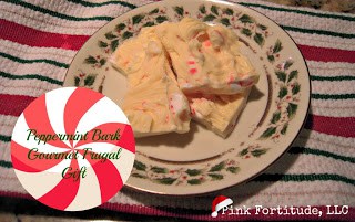 peppermint bark on a Christmas plate on a red, white and green striped cloth with title text reading Peppermint Bark Gourmet Frugal Gift