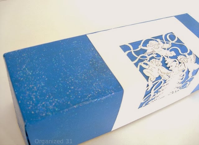 a blue box decorated with a Christmas card