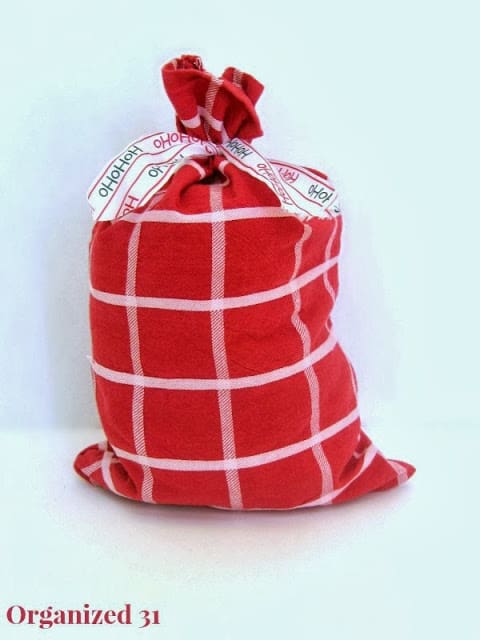 a red and white upcycled fabric gift bag