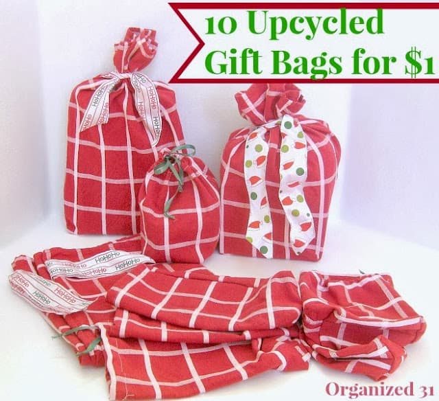 several upcycled red and white fabric gift bags next to red and white fabric with title text reading 10 Upcycled Gift Bags for $1
