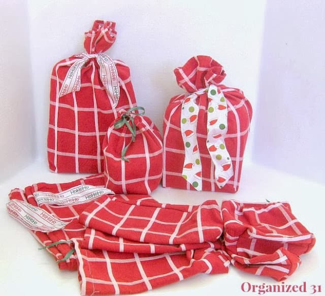 several red and white upcycled fabric gift bags