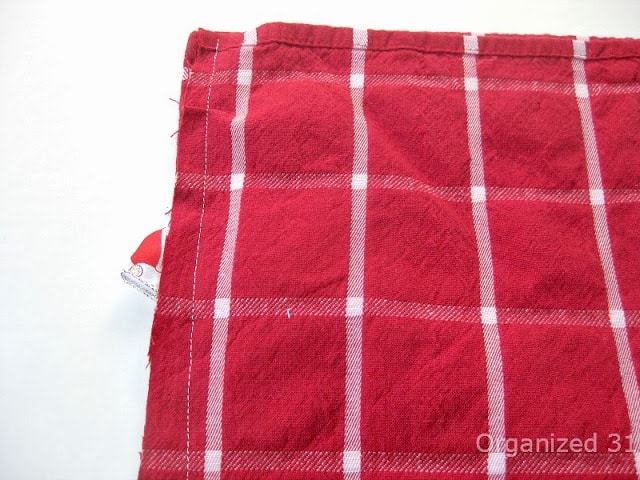 red and white tablecloth with a side seam stitched on it