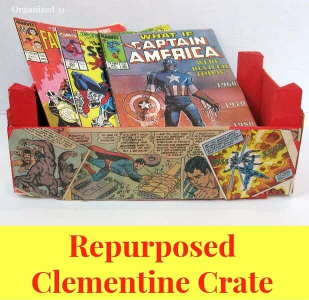 Red paint and comic book pages decorated Clementine Crate with Comic Books with title text reading Repurposed Clementine Crate