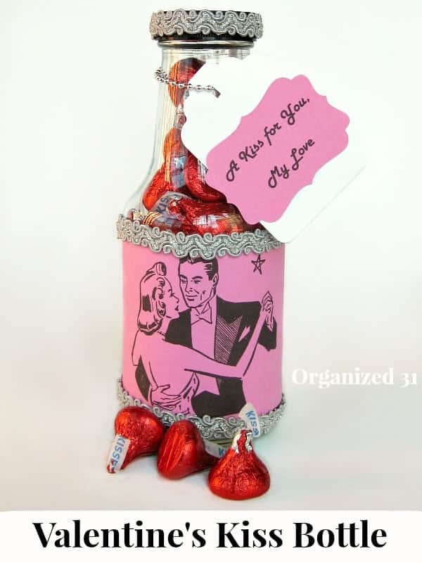 close up pink label on bottle of candy kisses with title text reading Valentine's Kiss Bottle