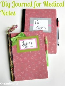 2 pink journals with pens on white table