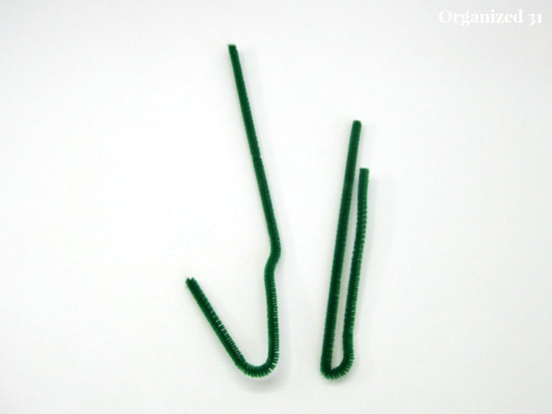 2 bent green pipe cleaners