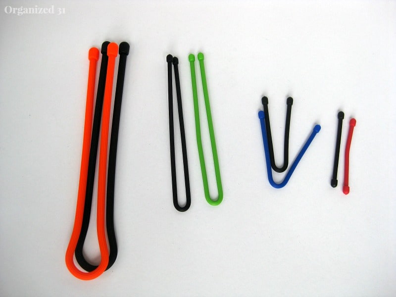 overhead view of different lengths of colorful cord ties on white table