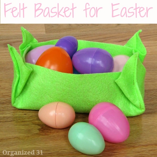 bright green felt basket filled with colorful plastic Easter eggs.
