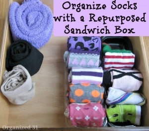 socks organized in a drawer with title text reading Organize Socks with a Repurposed Sandwich Box 
